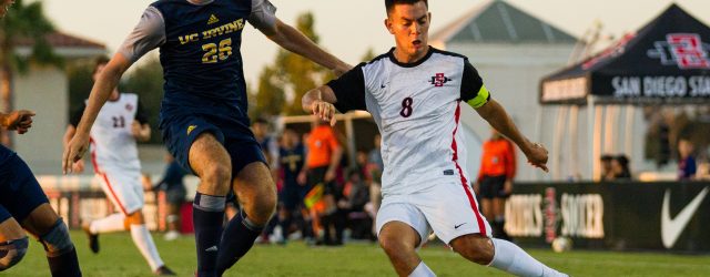 Senior Midfielder Pablo Pelaez kicks the ball against a UC Irvine defender
